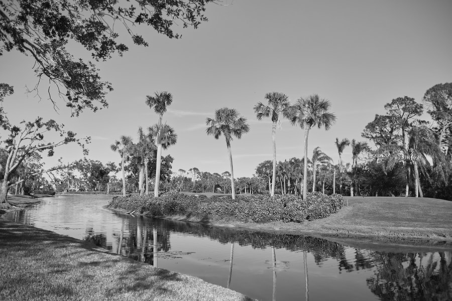 East Naples River flowing through a well manicured golf course