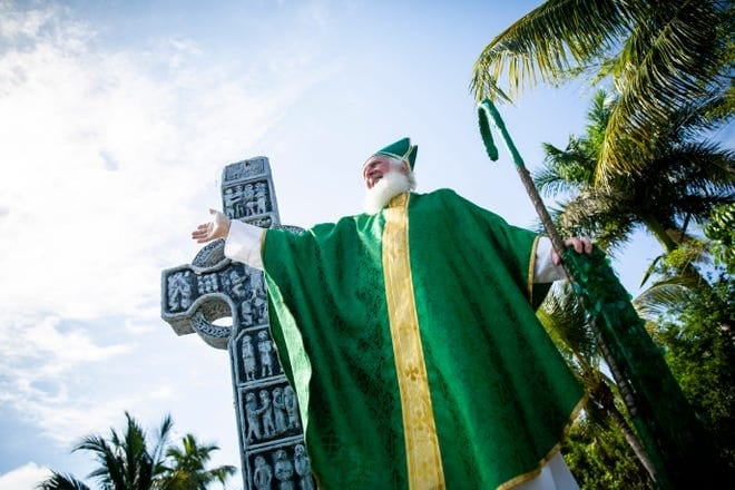 St Patrick in front of a cross at Naples Parade