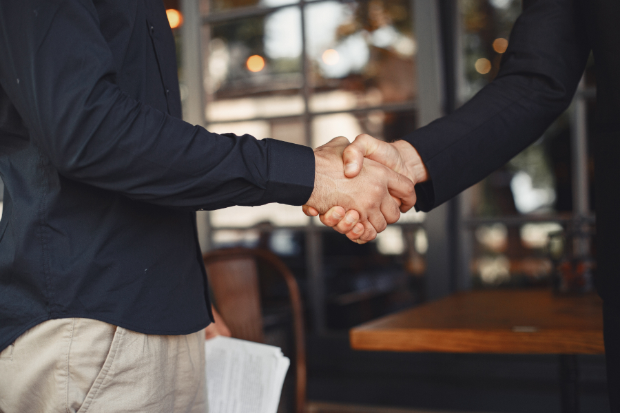 Business men shake hands after business agreement built after building a business relationship