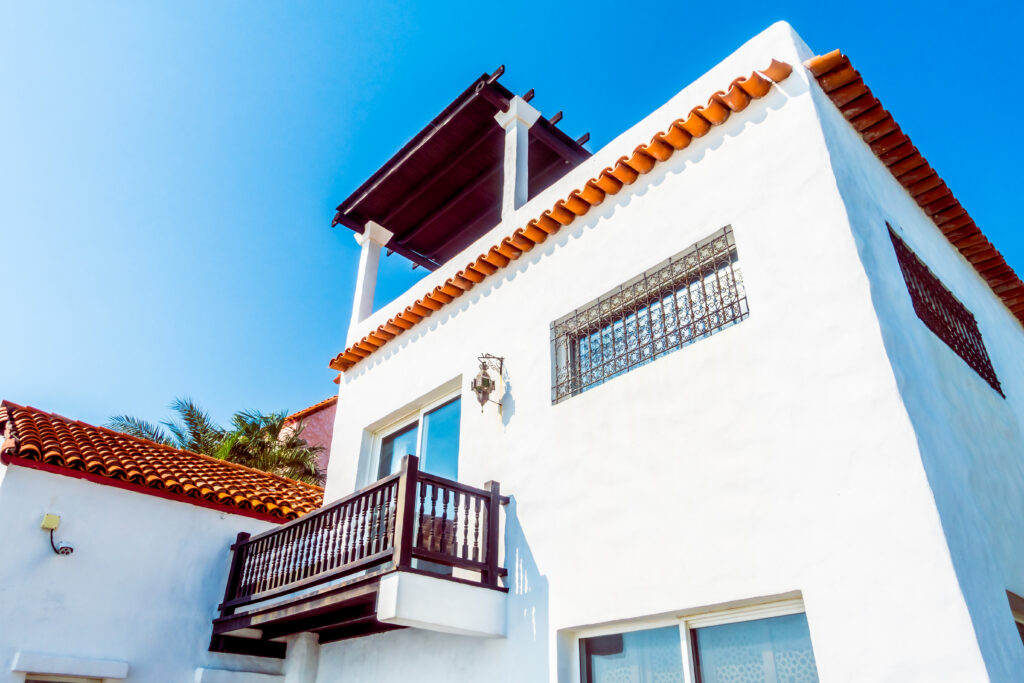 The Mediterranean style home is a popular Naples architecture with it's white stucco and roof for homes in the area